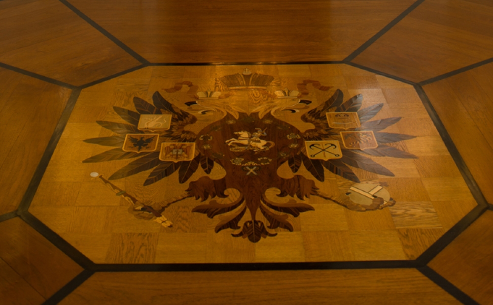 The imperial coat of arms, a double-headed eagle, inlaid in the center of the floor at Hillwood, Washington DC