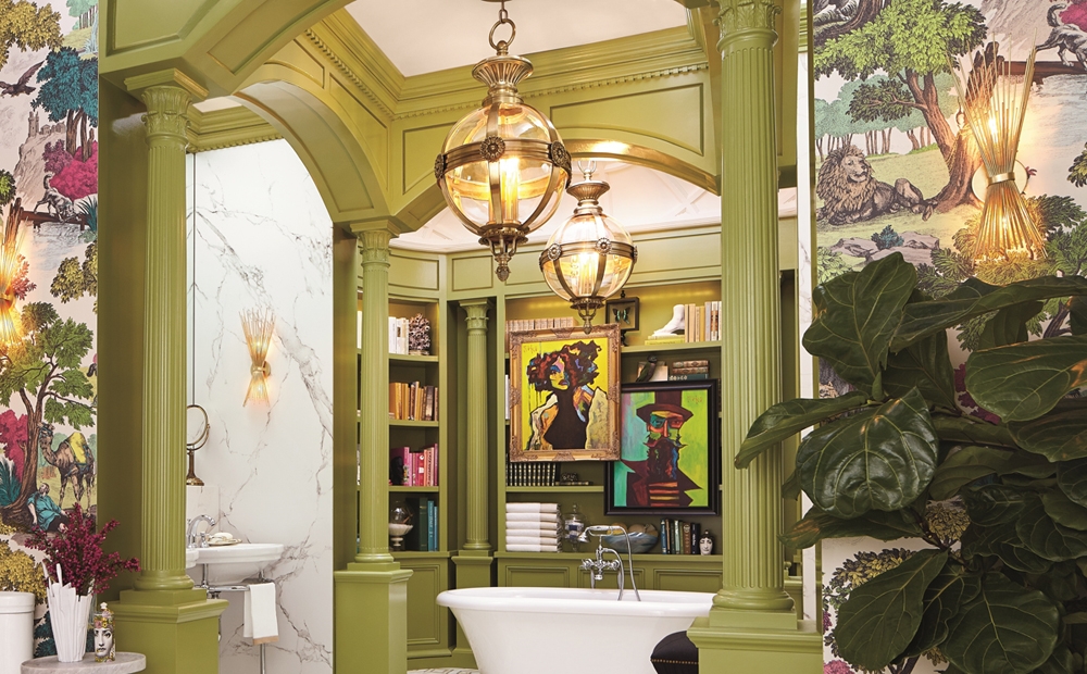Bold bathroom featuring avocado green pillars and milling with large scale wall paper and bold contemporary art