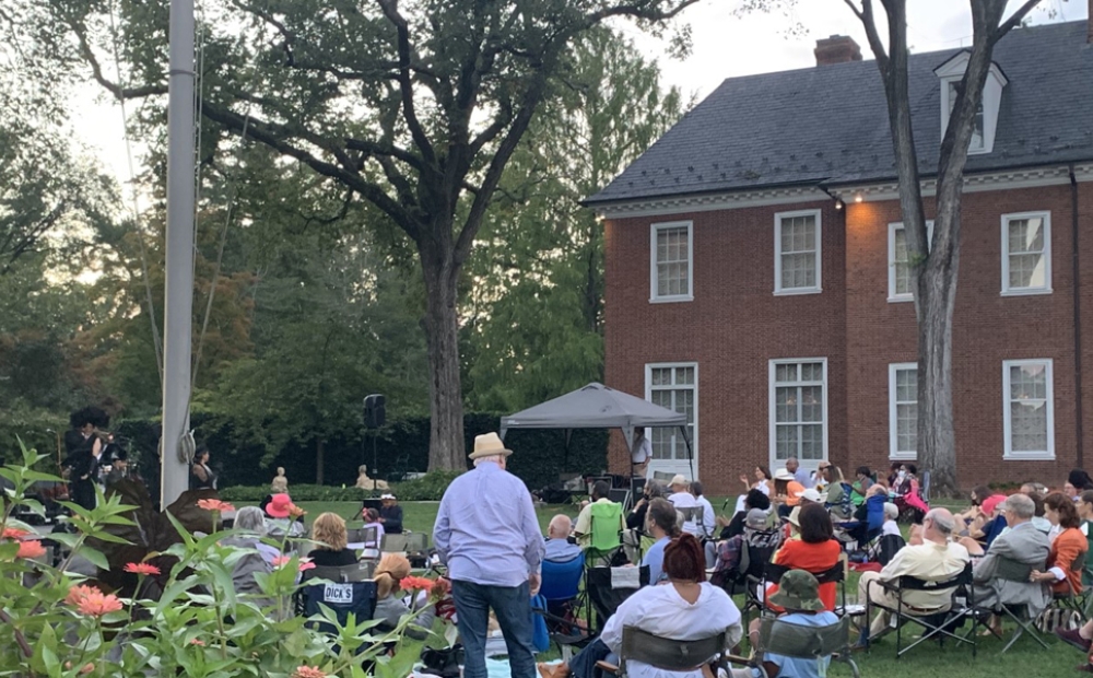 Crowd at evening concert on Hillwood's Lunar Lawn, set before Hillwood's mansion