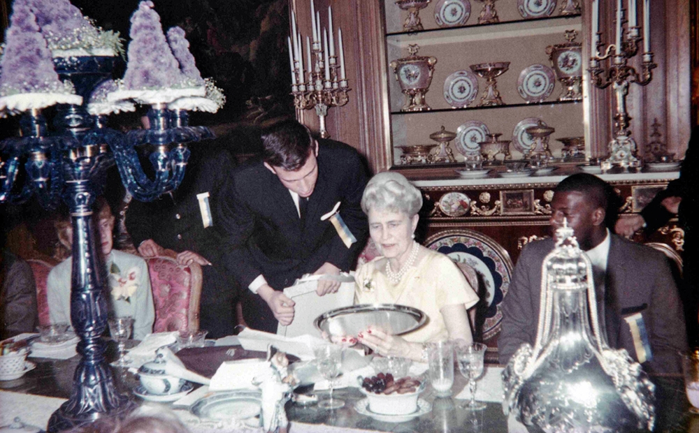 Marjorie Post with students in the dining room
