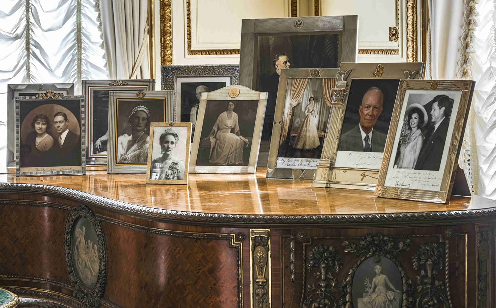 Photos on the piano in the French drawing room