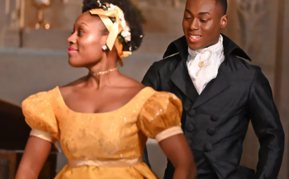 Image of two dancers standing near each other. 