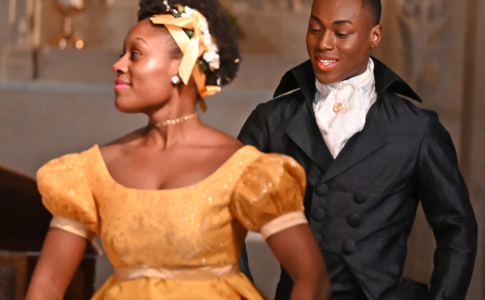 Image of two dancers standing near each other. 