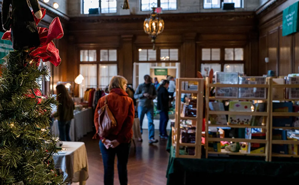 People walking around booths at previous Strathmore market